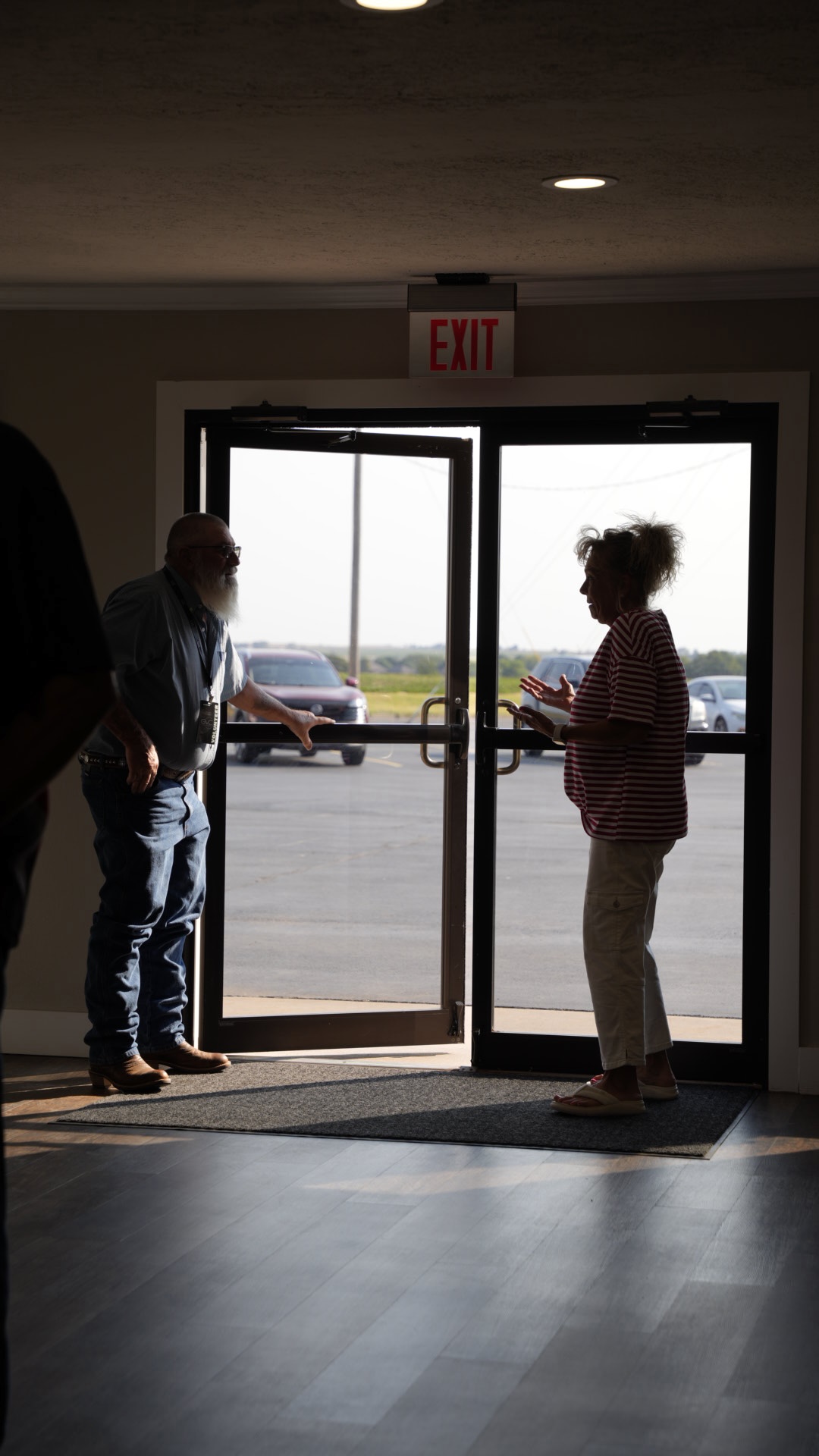 Church members greeting each other at the front doors